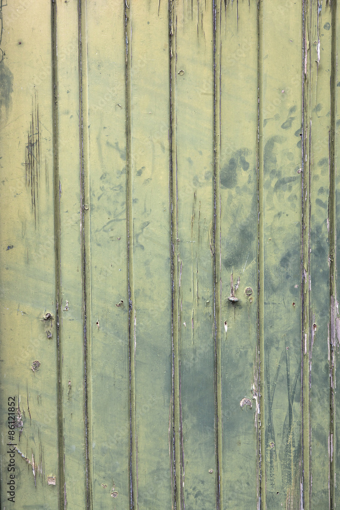 faded green planks of old wooden door faded green planks of old wooden door
