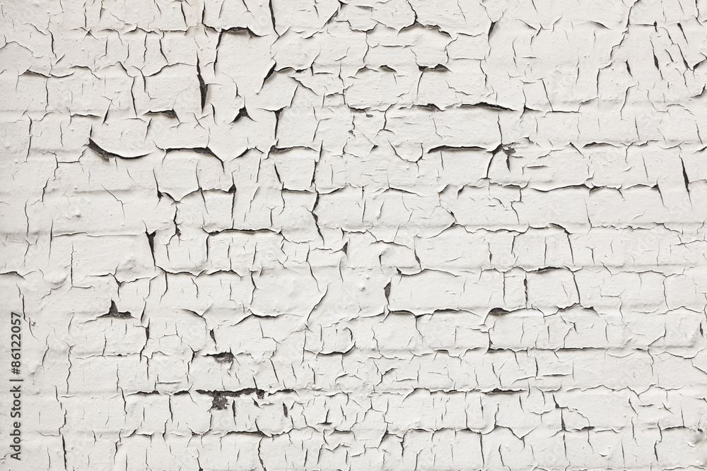 abstract pattern of cracks in white washed wall abstract pattern of cracks in white washed wall