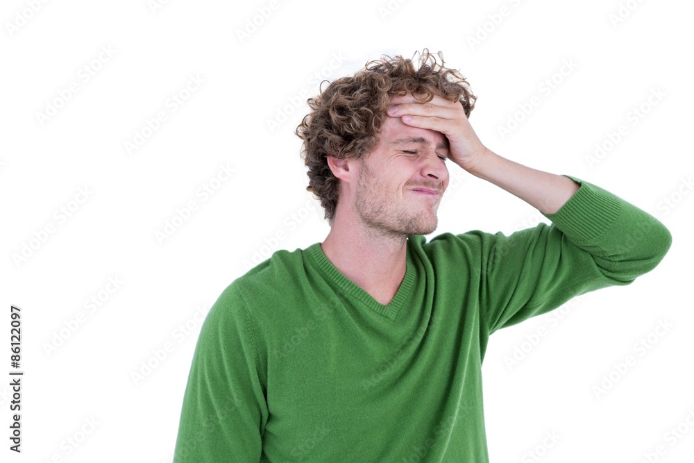 Anxious casual man standing with hand on forehead Anxious casual man standing with hand on forehead