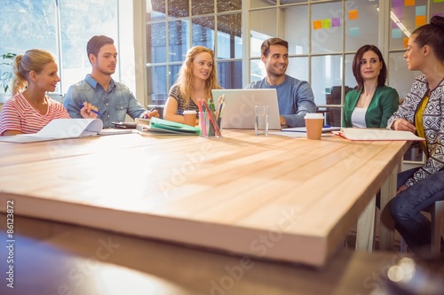 Group of young colleagues using laptop