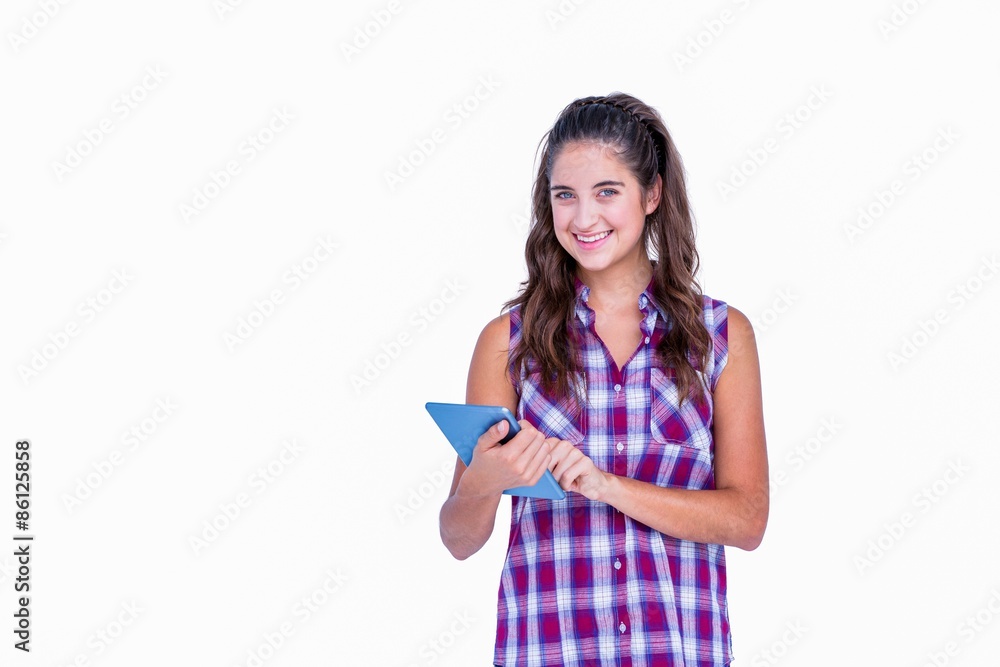 Happy pretty brunette using tablet computer Happy pretty brunette using tablet computer