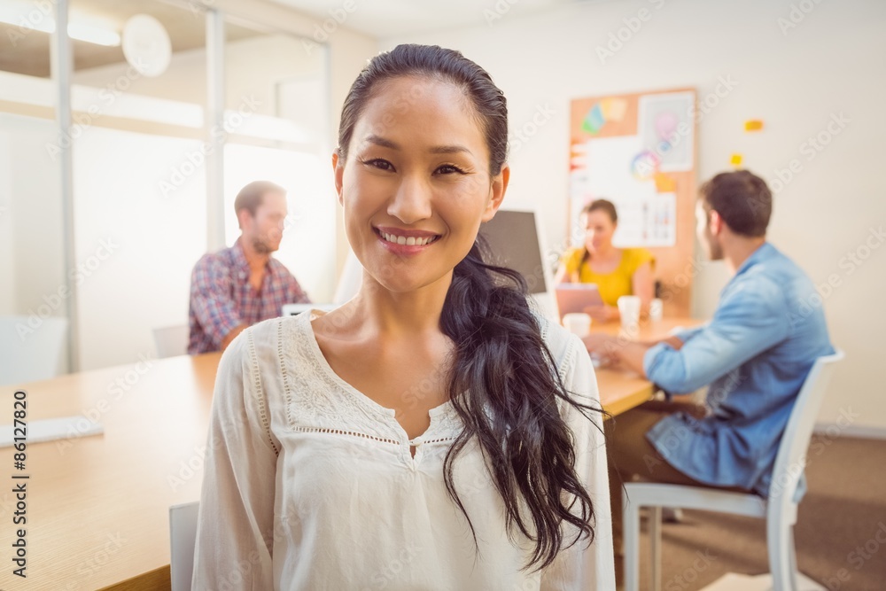 Smiling businesswoman looking at the camera Smiling businesswoman looking at the camera