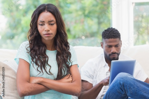 Upset woman being ignored by partner