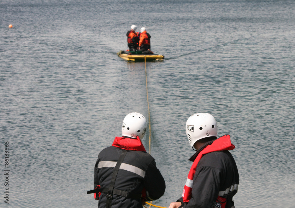 Fototapeta premium fire fighters at water rescue incident