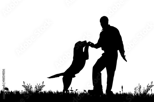Vector silhouette of a man with a dog.