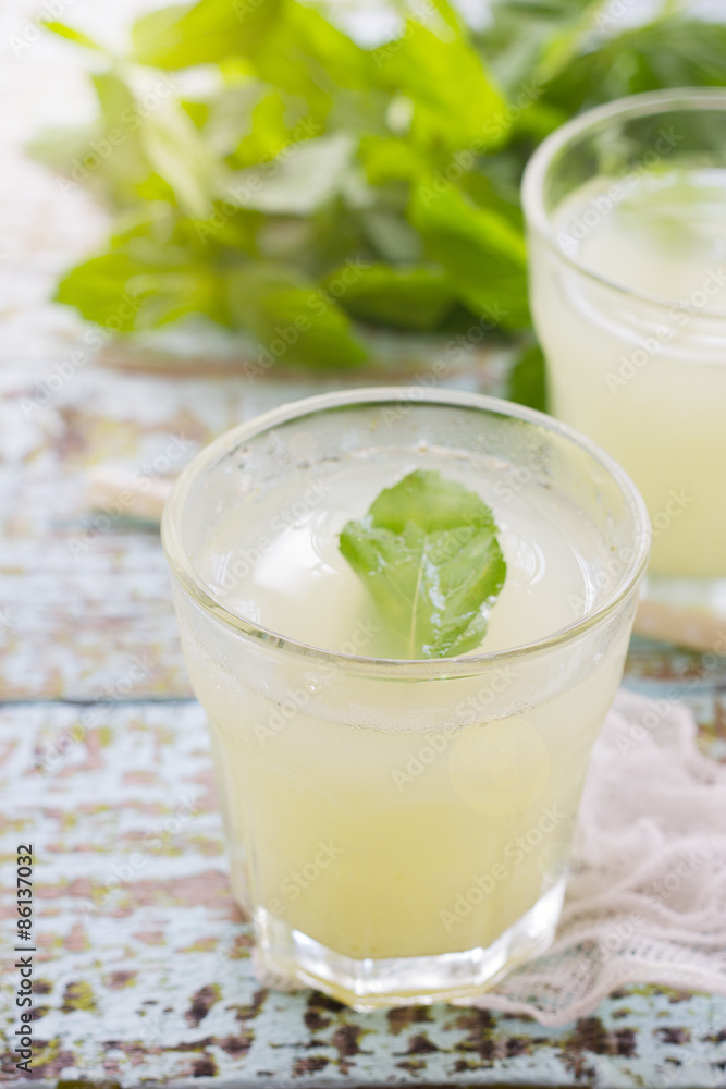 Two glass of fresh lemonade decorated with mint leaves Two glass of fresh lemonade decorated with mint leaves
