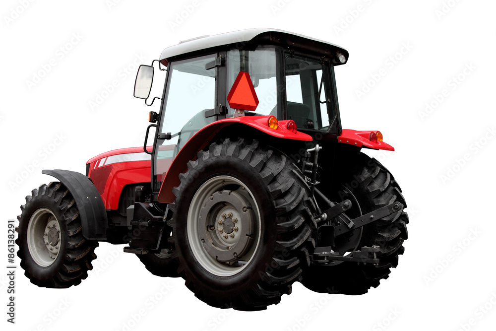 The modern red tractor is isolated on a white background The modern red tractor is isolated on a white background