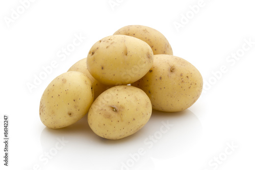 Potatoes on the white background.  New harvest.