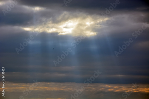 Sun through the stormy clouds. Natural background