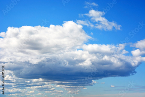 Fluffy clouds on the blue sky. Natural background