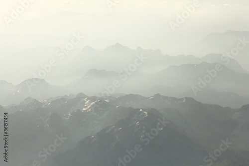 Mountain landscape in the mist on the horizon