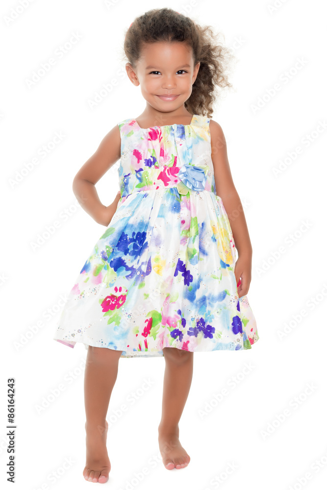 Cute small girl wearing a flowers summer dress Cute small girl wearing a flowers summer dress