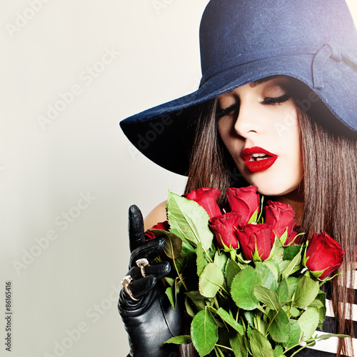 Nice Girl. Beautiful Woman with Rose Flowers. Women's Sweet Drea photo