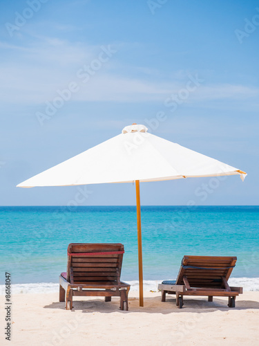 beds and umbrella on a beach