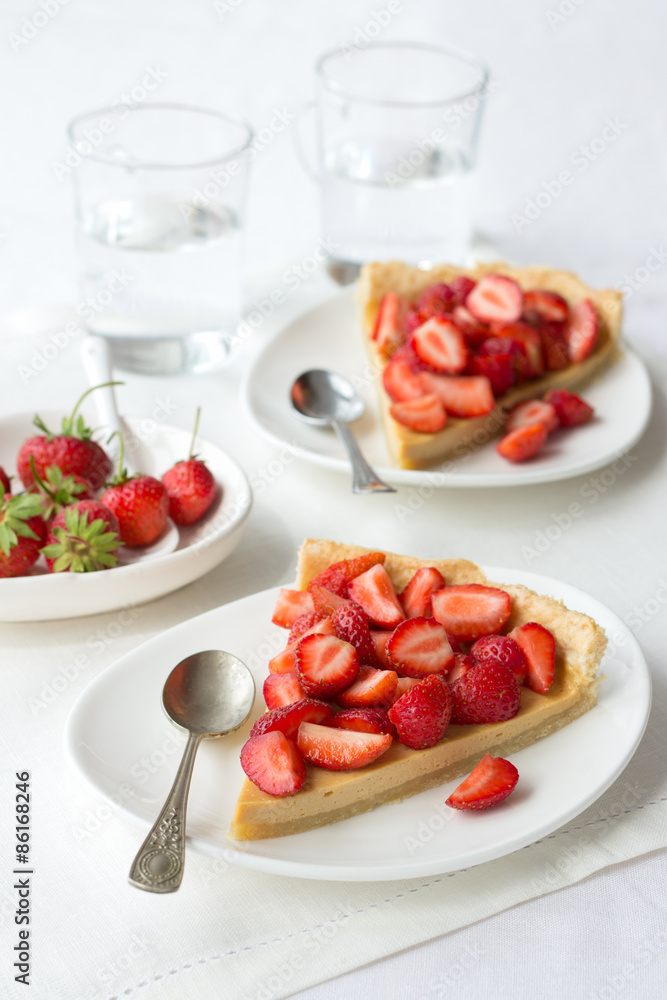 Tart with Greek yogurt and fresh strawberries on textiles Tart with Greek yogurt and fresh strawberries on textiles