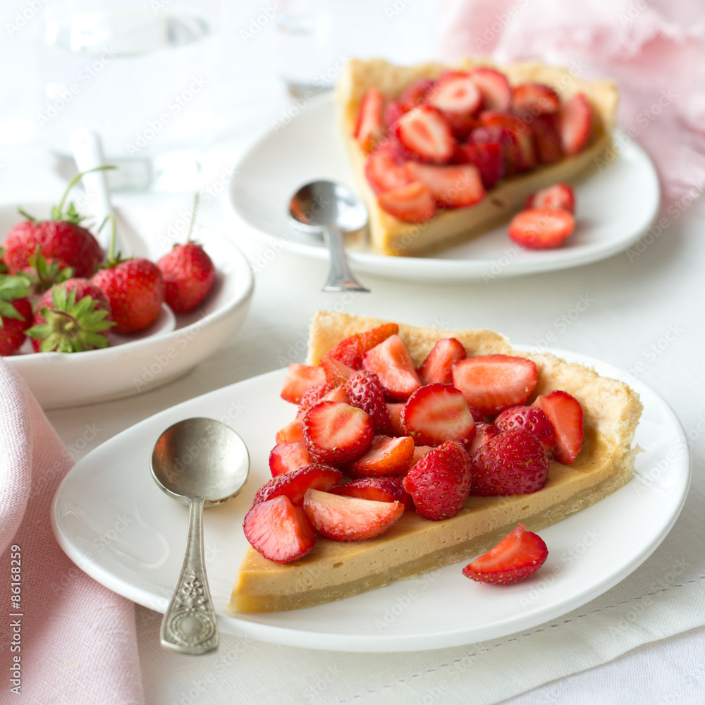 Tart with Greek yogurt and fresh strawberries on textiles Tart with Greek yogurt and fresh strawberries on textiles