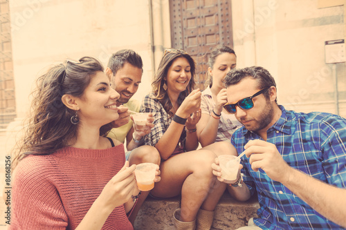 Group of tourists eating slush in Italy