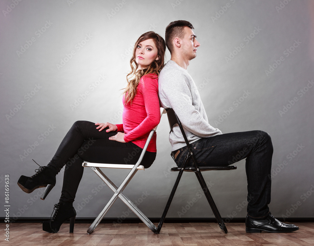 Obraz premium Unhappy couple sitting back to back. Disagreement.