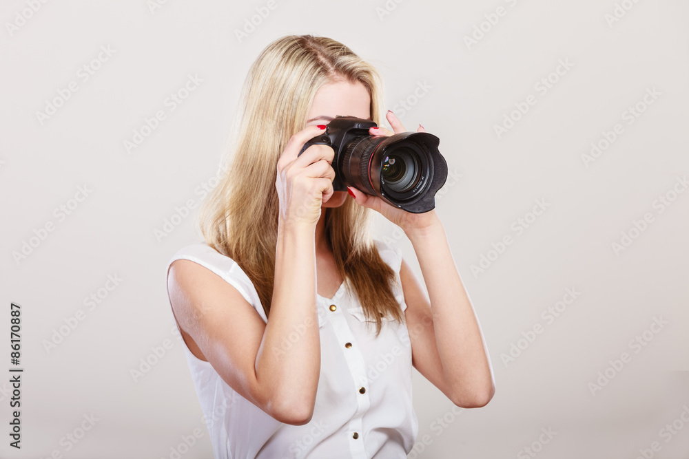 Photographer girl shooting images Photographer girl shooting images