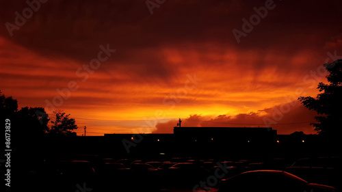 Fiery Orange Sunset Over Parking Lot photo