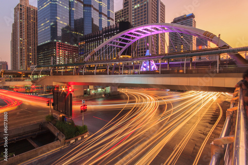 Modern building at night. Traffic in the business district The Skytrain station Chong Nonsi