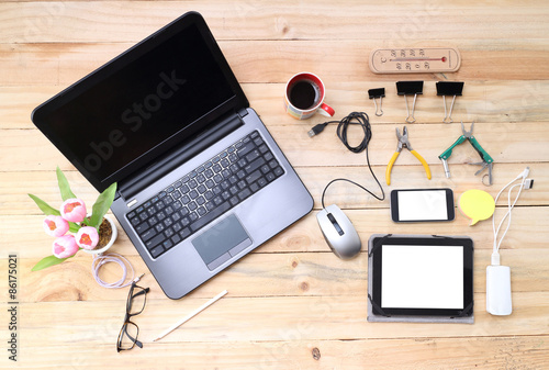 Creative professional's work table and tech gadgets from above