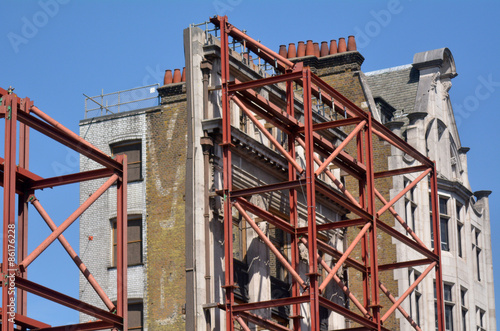 Faced of resorted old building in Oxford street in London, UK photo