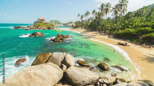 Time lapse of waves coming into the beach at Cabo San Juan del Guia in Tayrona National Park in Colombia photo