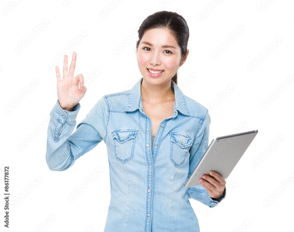 Asian woman use of digital tablet and ok sign gesture Asian woman use of digital tablet and ok sign gesture