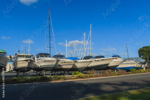 The bows of boats sticking out of the rack 