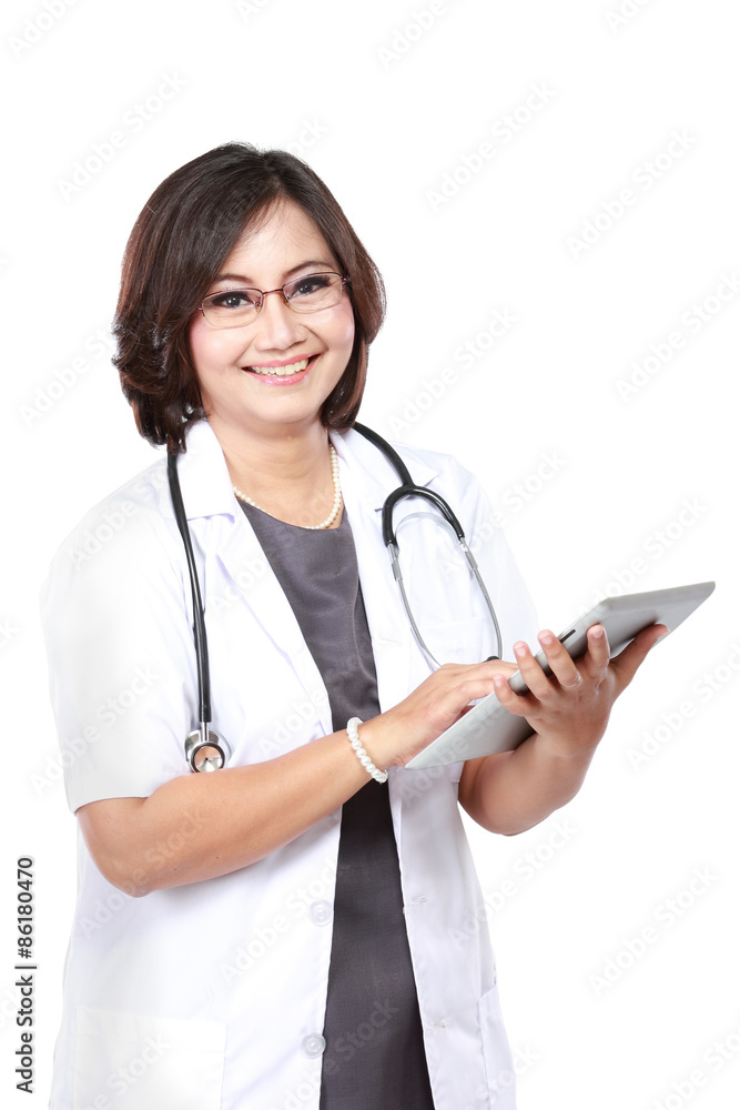 middle aged woman doctor using tablet computer middle aged woman doctor using tablet computer