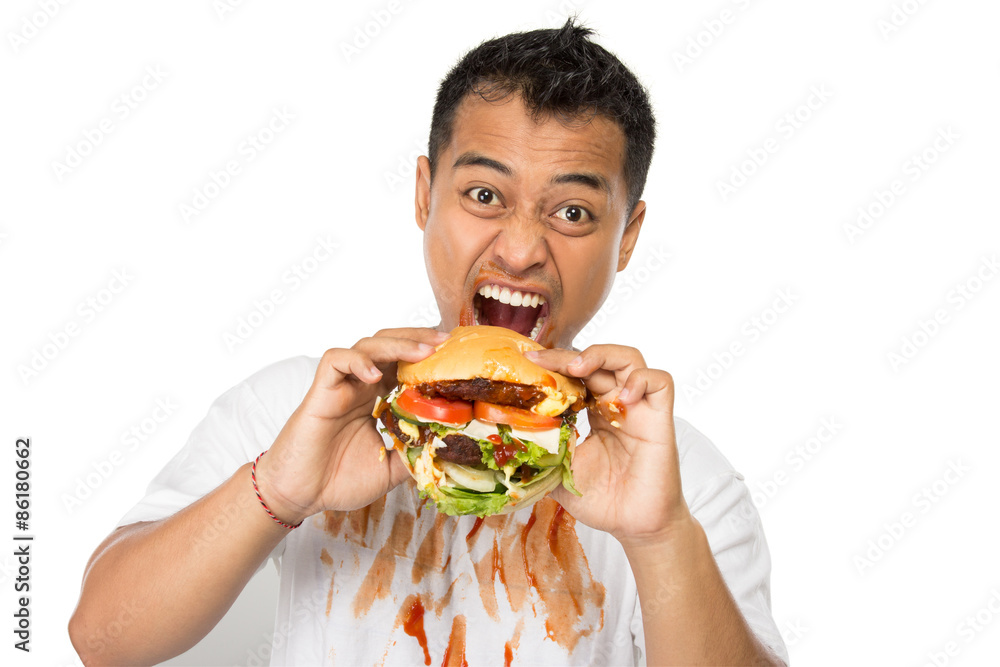 Young man have a great desire to eat a burger Young man have a great desire to eat a burger