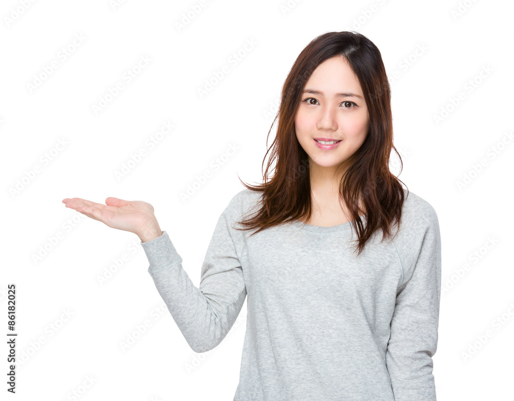 Asian woman with open hand palm showing something Asian woman with open hand palm showing something