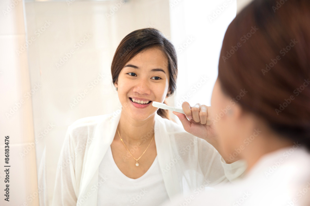 Asian young woman tooth brushing her teeth happily Asian young woman tooth brushing her teeth happily