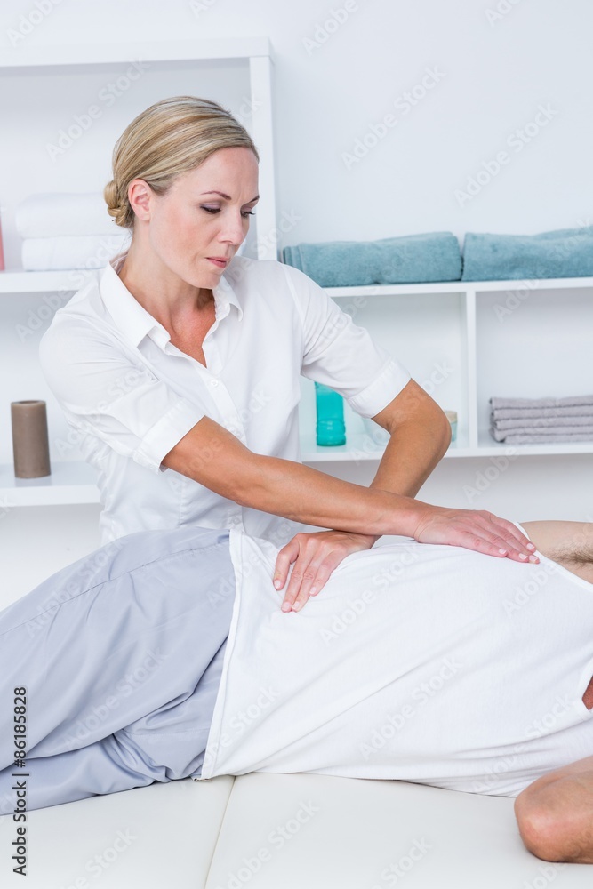 Doctor examining her patient back Doctor examining her patient back