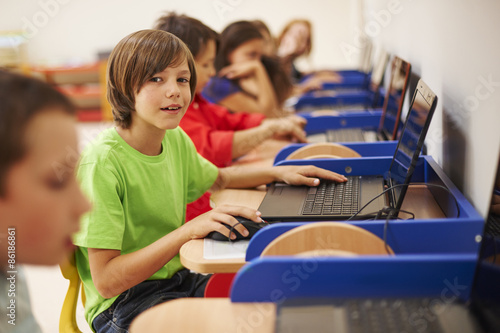 Pupils sitting at the computer science lesson photo