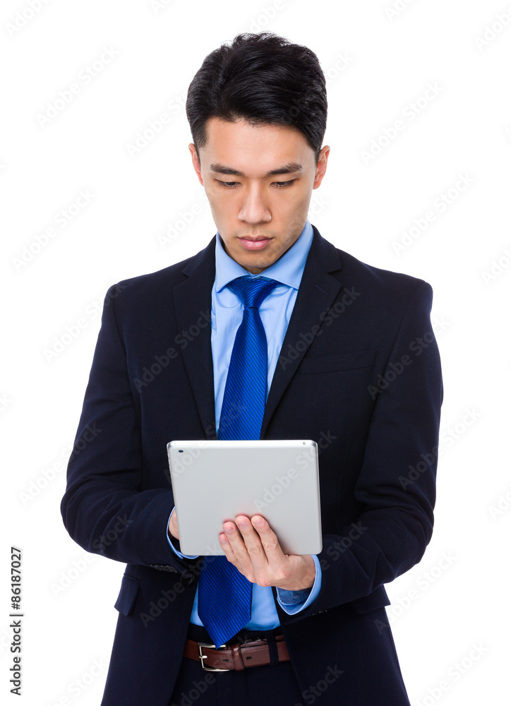 Young businessman use of digital tablet Young businessman use of digital tablet