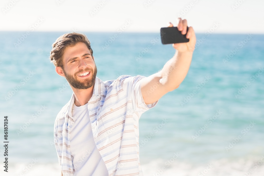 Happy man taking selfie