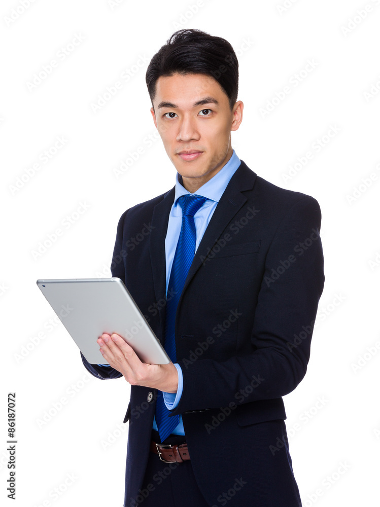Asian businessman use of tablet pc Asian businessman use of tablet pc