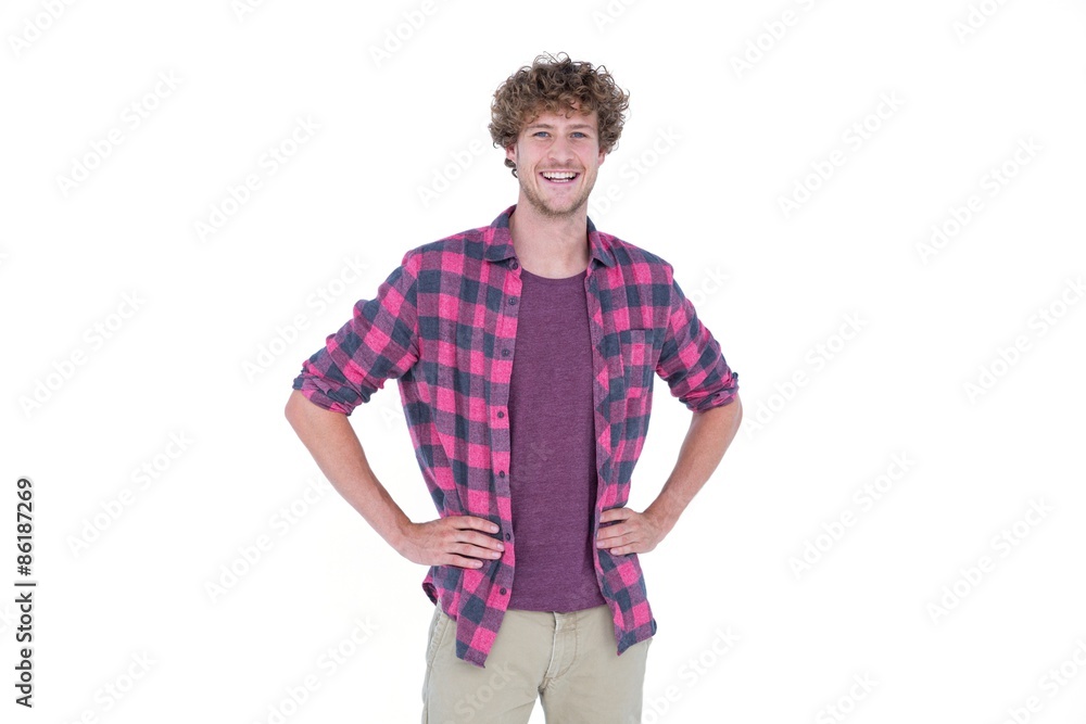 Handsome man looking at camera with hands on hips Handsome man looking at camera with hands on hips