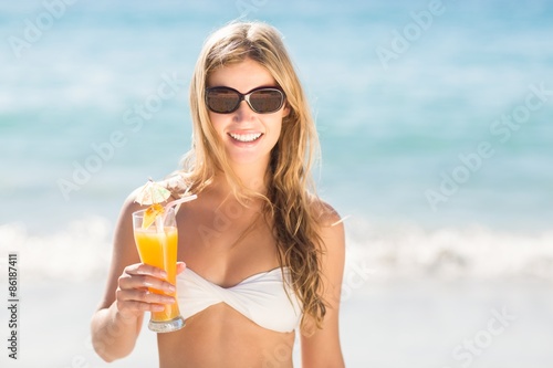 blonde drinking a cocktail