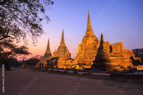 Asian religious architecture. Ancient pagoda at Wat Phra Sri Sanphet temple under twilight sky. Ayutthaya, Thailand