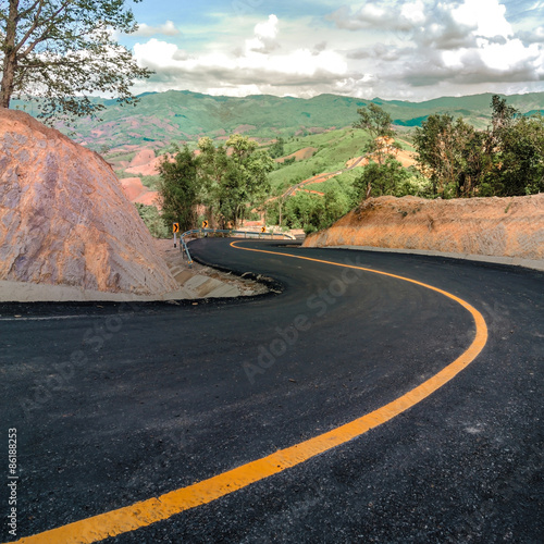 Beautiful asphalt road and sharp curve climb on mountain photo