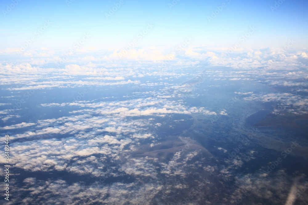 view from the bird's-eye view of the airplane window at the horizon and clouds view from the bird's-eye view of the airplane window at the horizon and clouds