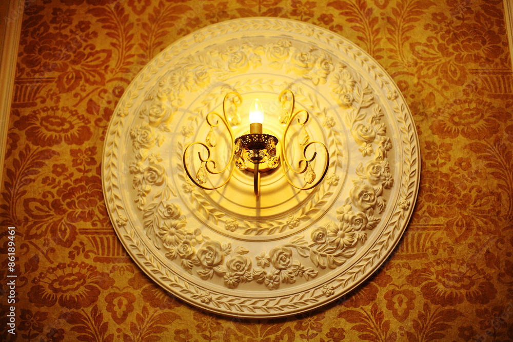 decorative bas-relief on the wall under the lamp decorative bas-relief on the wall under the lamp