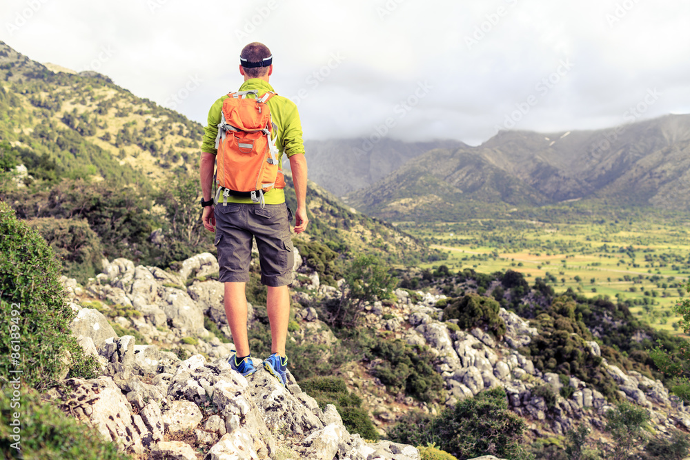 Hiking man looking at beautiful mountains