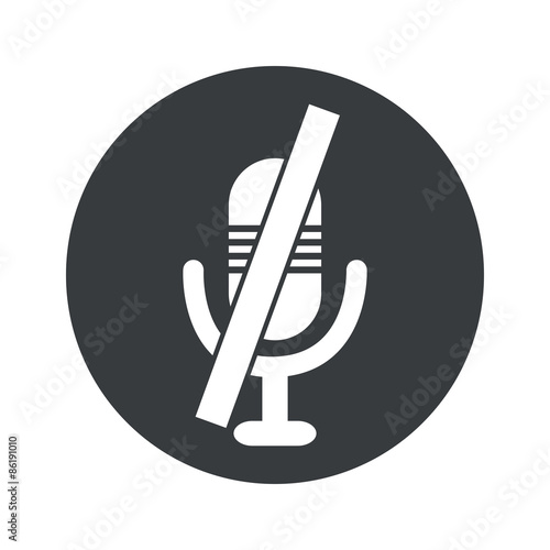 Monochrome round muted microphone icon