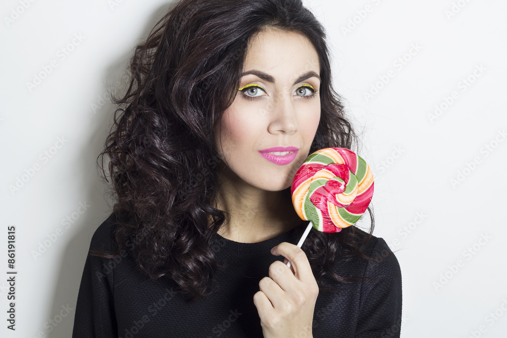 Portrait of beautiful young woman with lollipop Portrait of beautiful young woman with lollipop
