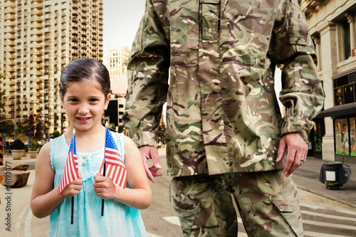 Composite image of soldier reunited with his daughter photo