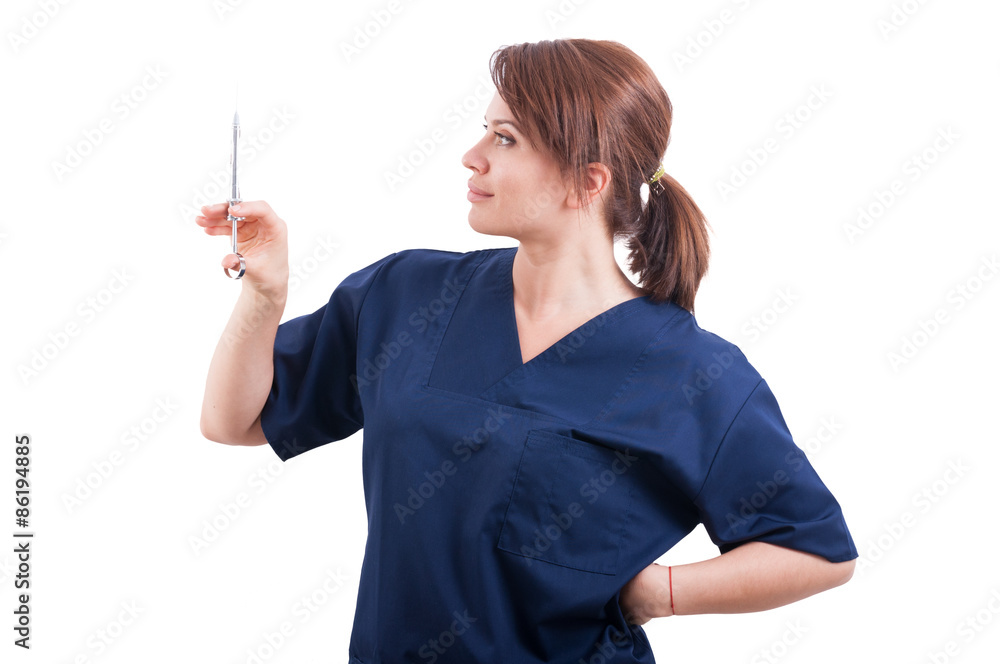 Confident female doctor holding syringe with anesthetic Confident female doctor holding syringe with anesthetic